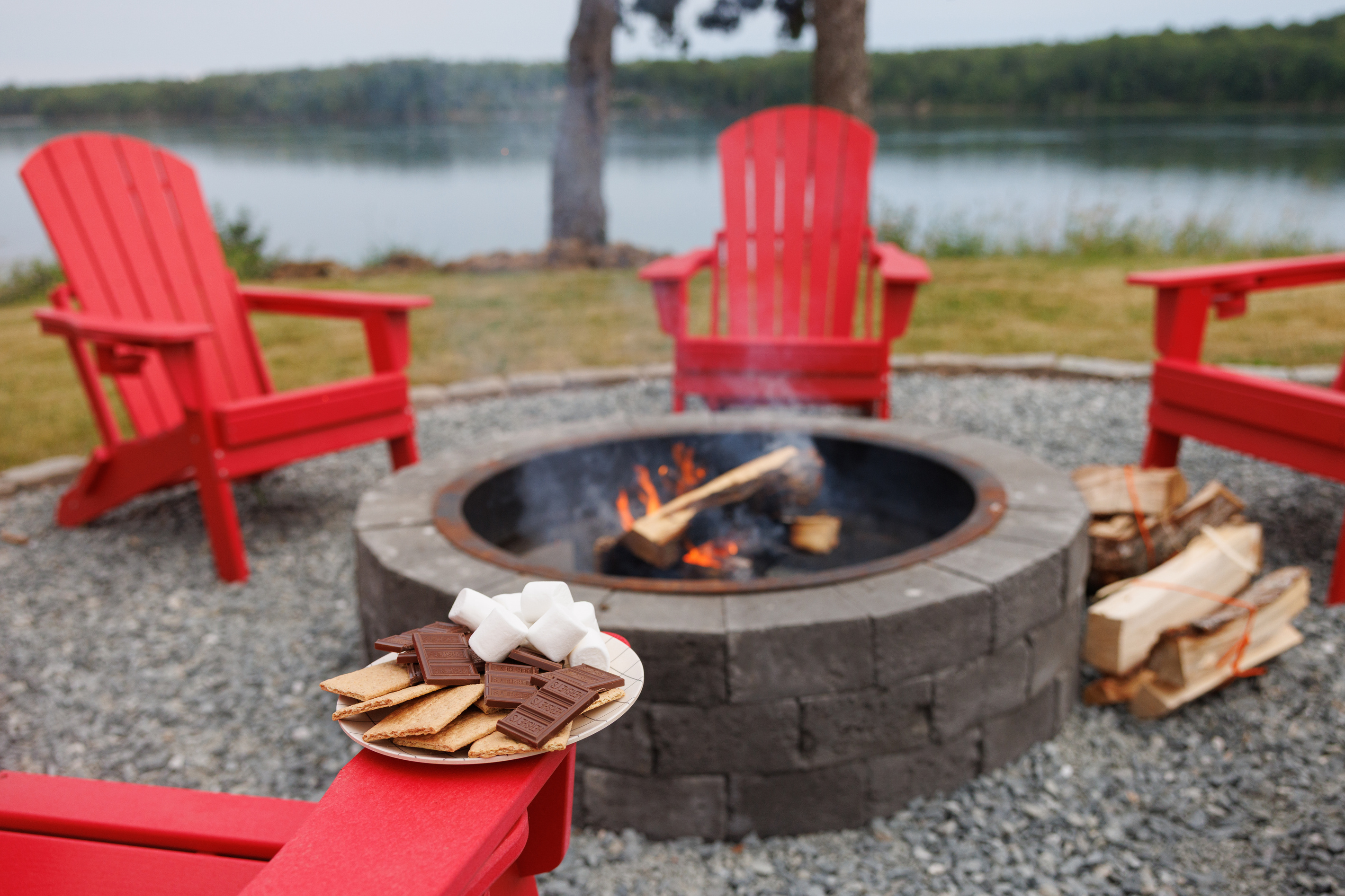  Pull up an Adirondack chair at the fire pit and let the warmth reach you while the bay fades behind the treeline — s’mores entirely optional.