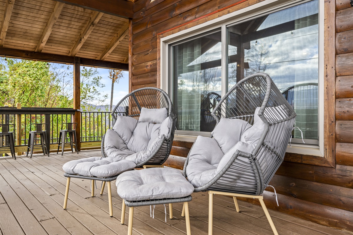 Relax in cozy egg chairs at Signature Stay, perfect for unwinding and soaking up the serene mountain views