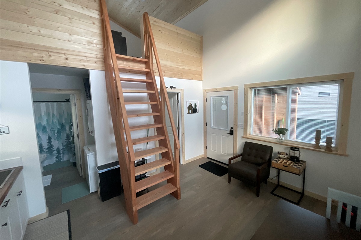 Main floor area.  Bathroom and laundry are in the left front and bedroom is in the left rear.  Ships ladder access to the loft living area and additional sleeping space.