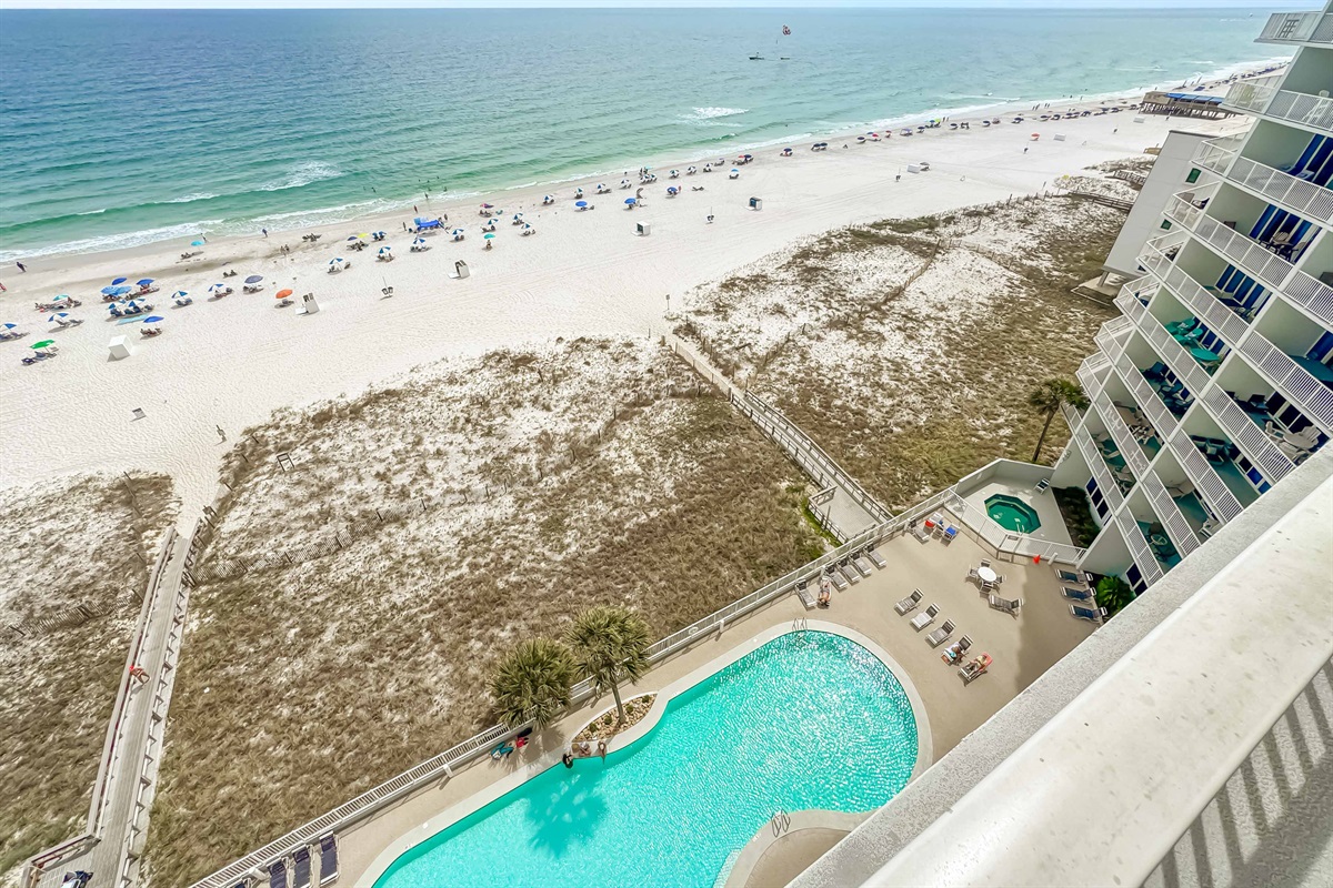 Where the pool meets the ocean.  Enjoy a seamless blend of relaxation and recreation in this idyllic beachfront setting.