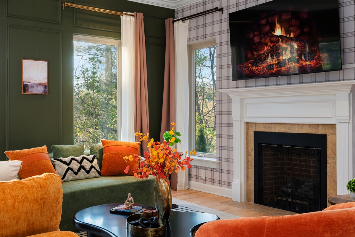 Additional lounge space with fireplace and large windows - multiple areas to gather without feeling crowded