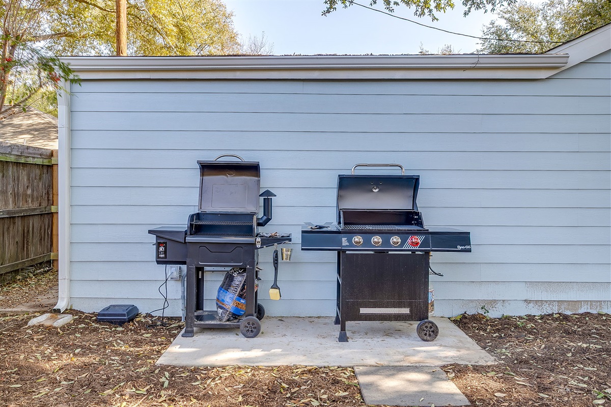 Outdoor grill station with propane grill and electric smoker