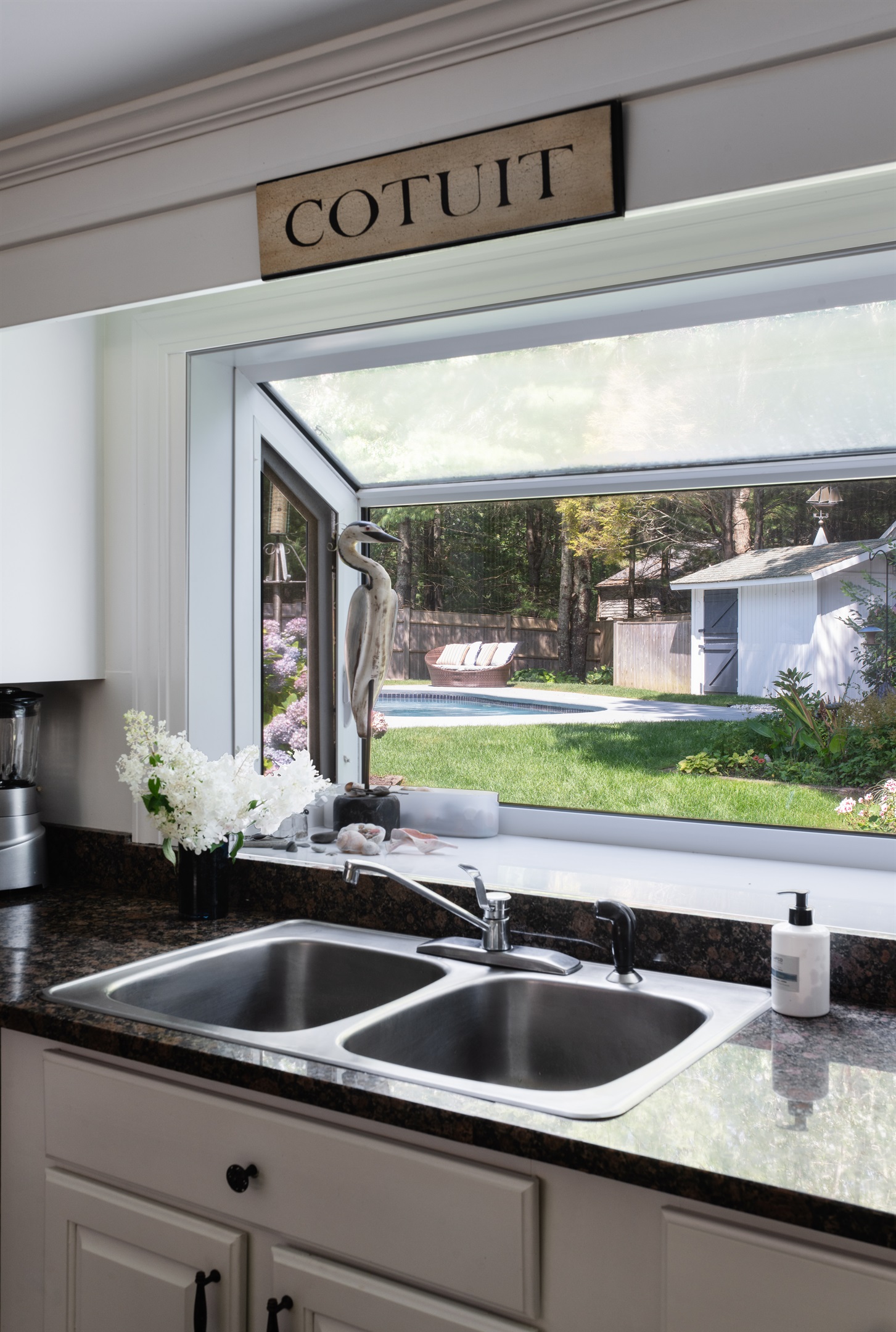 Prep and clean with a serene pool view just outside.