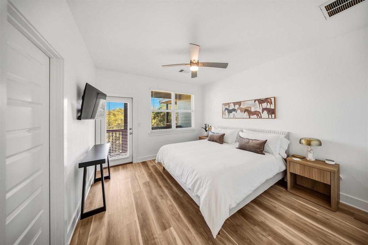 Primary bedroom with a king bed and a comfortable modern design. Enjoy your own private balcony. 