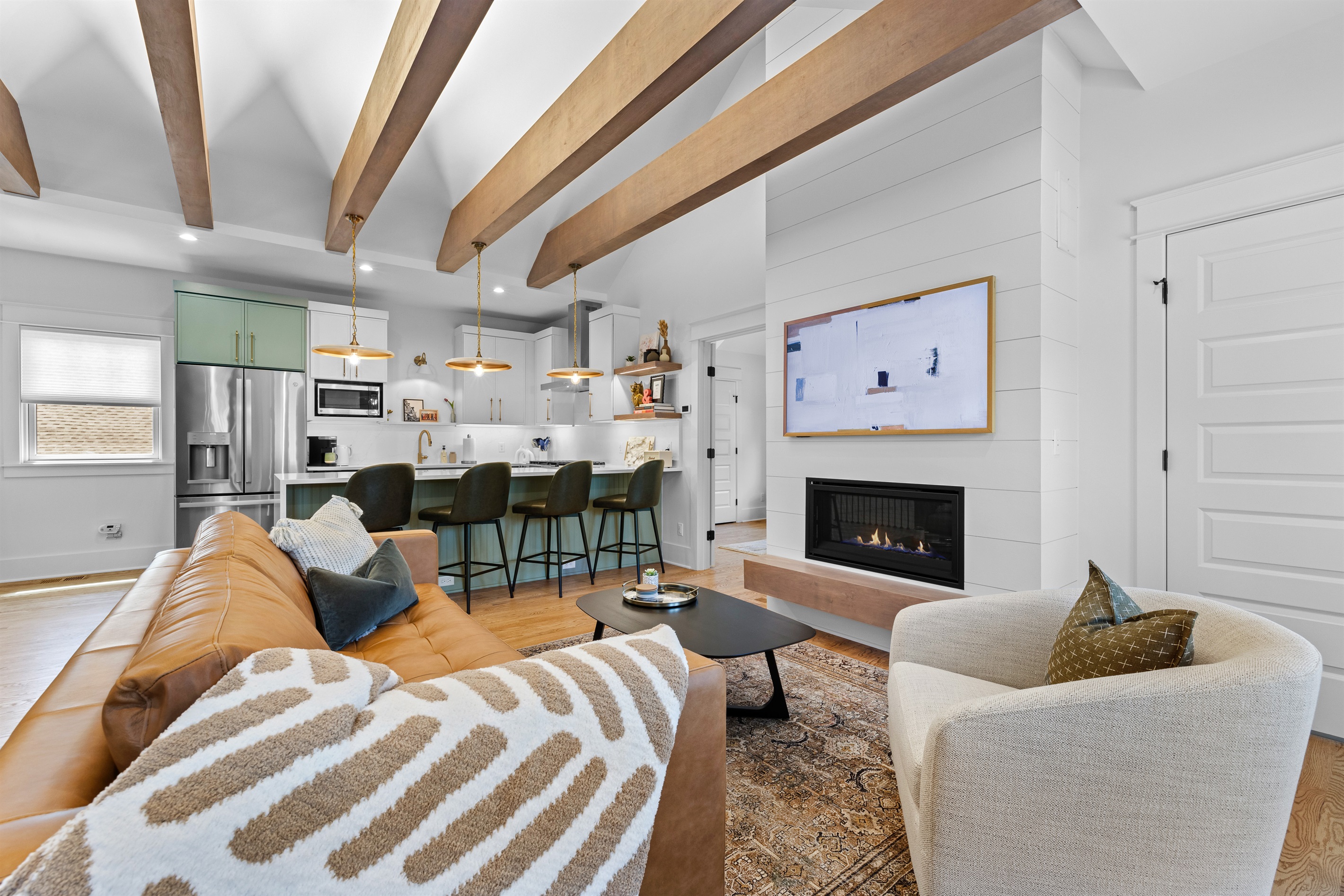 Stylish living area flowing seamlessly into the kitchen.