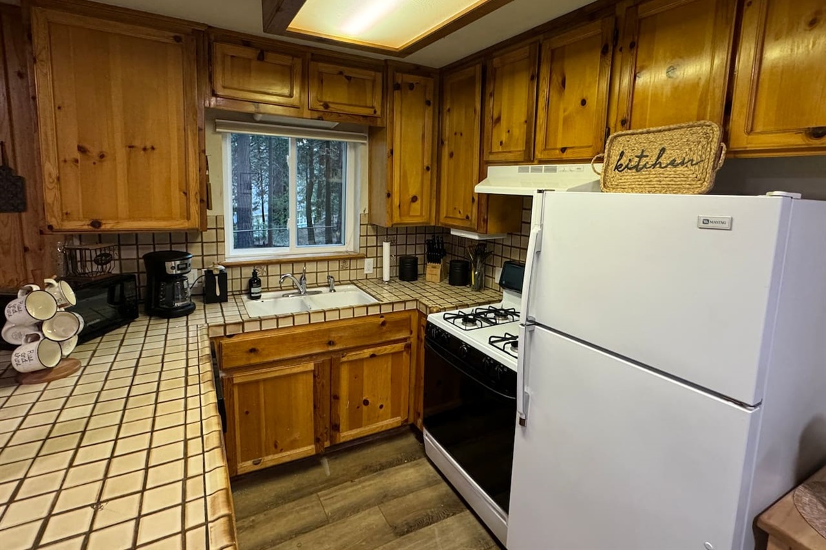 This kitchen is stocked by two home chefs. Help yourself to the spices, oils and pantry staples. 