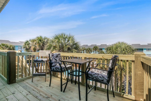 New back deck with balcony that over looks the pools.