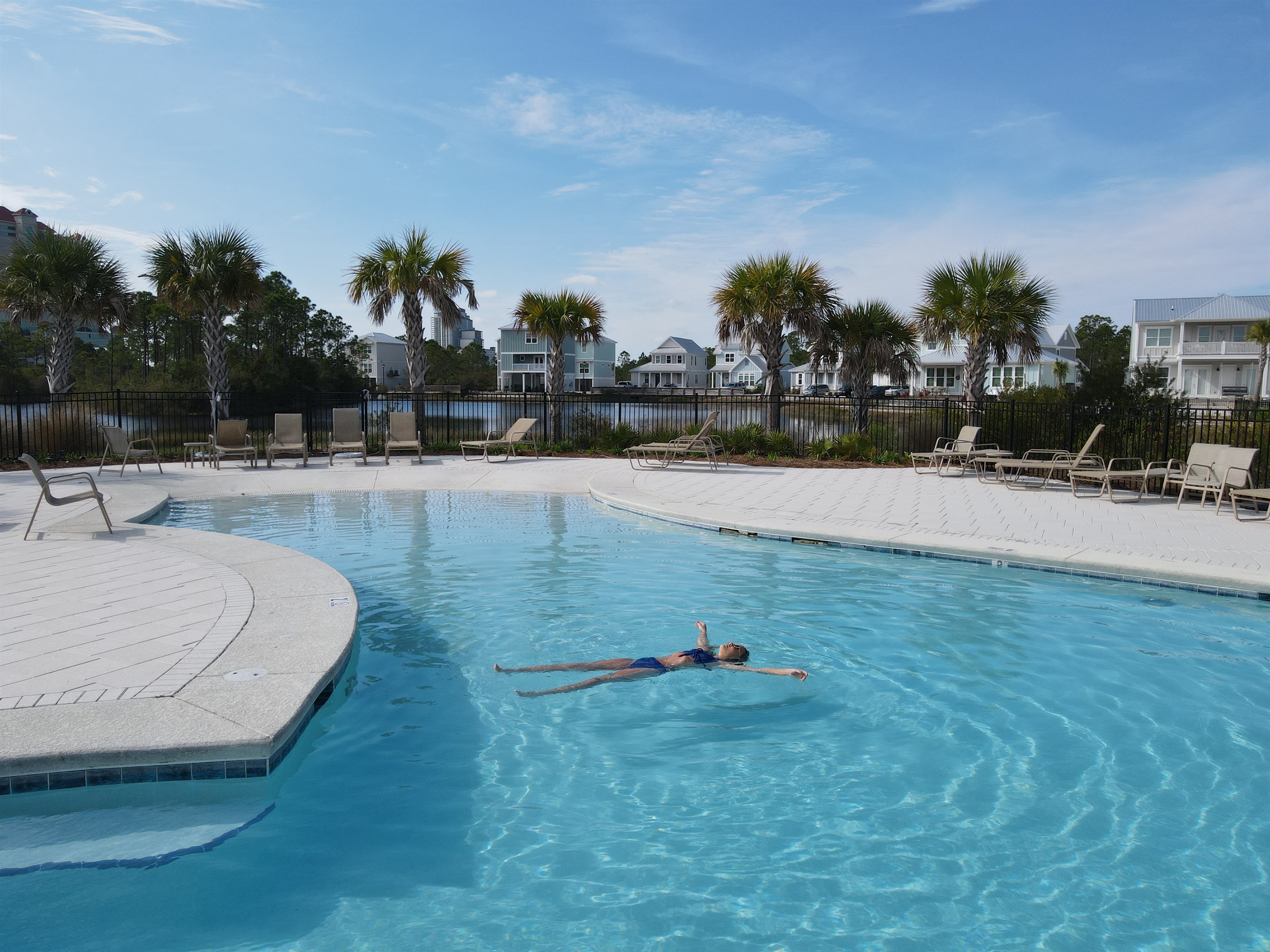The swimming pool is the perfect place to relax and enjoy on a hot summer day.