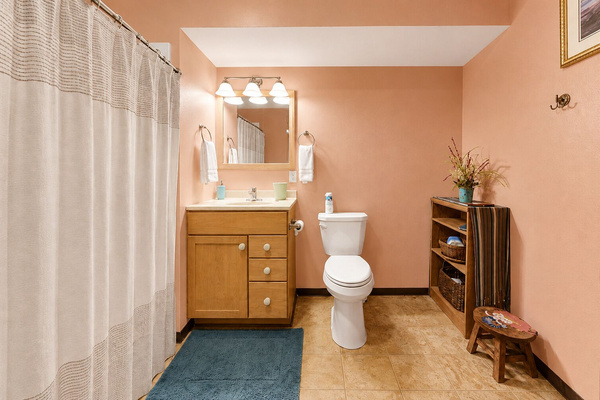 A comfortable and convenient full bathroom serving the main living areas of the home.