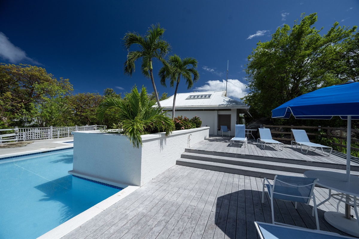 The communal pool is ideal for lounging under the sun.