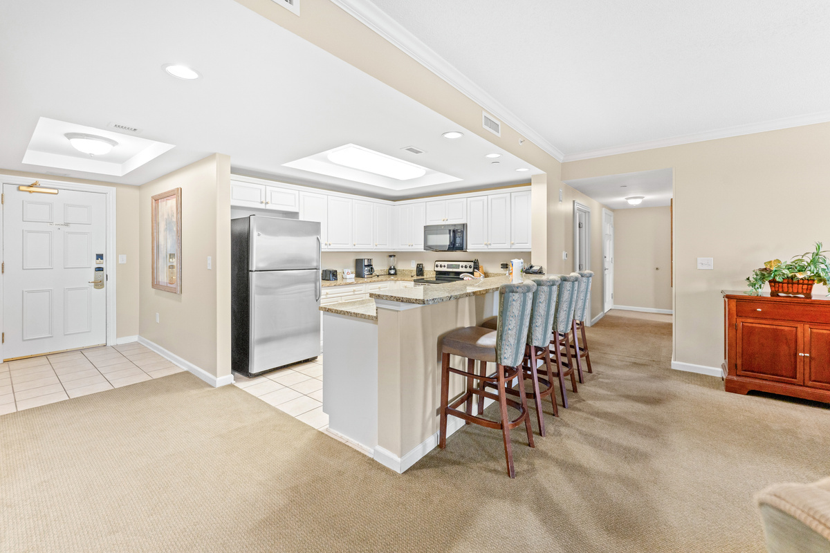 Breakfast bar off the kitchen for more seating