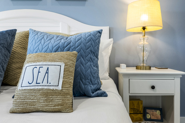 Lie in bed and enjoy the ocean waves AND the 50 inch tv in the Murdoch's Souvenir Shop themed Primary Suite.