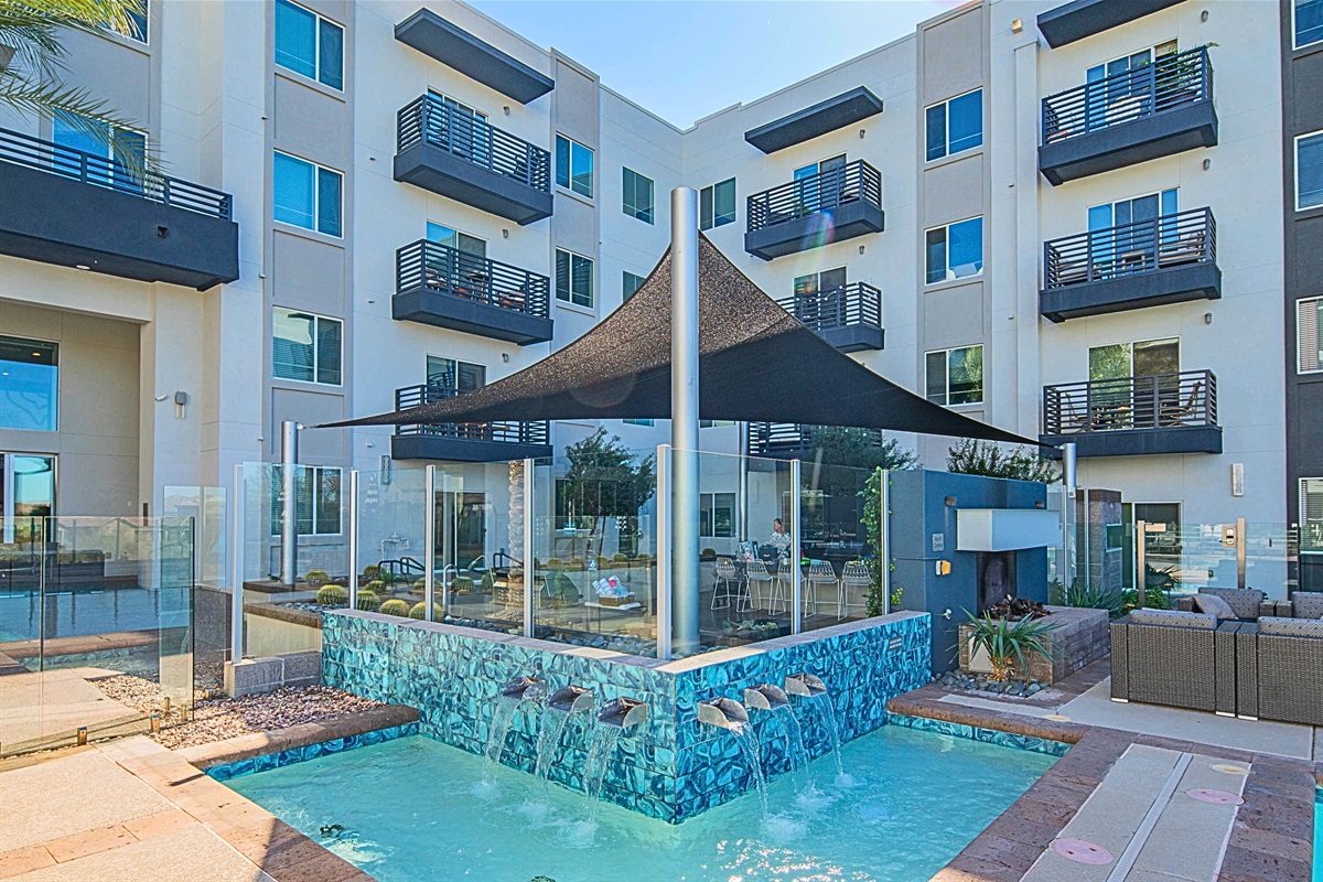 Relaxing oasis! Enjoy the calming water feature and shaded seating.