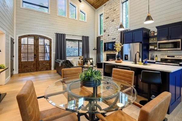 Kitchen and dining area with modern finishes and natural light.