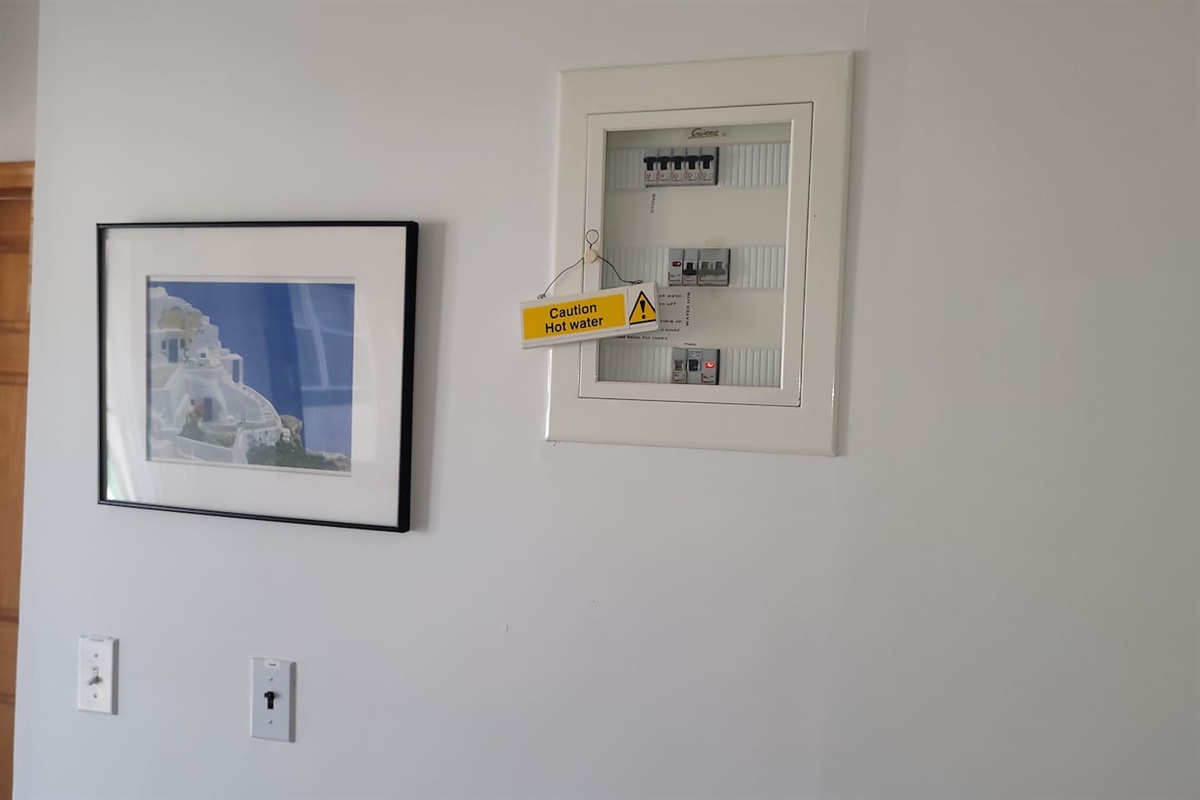 Upstairs in the common area: Electrical box and hot water heater. We have solar heated water, this is only used if you run out of hot water. 
