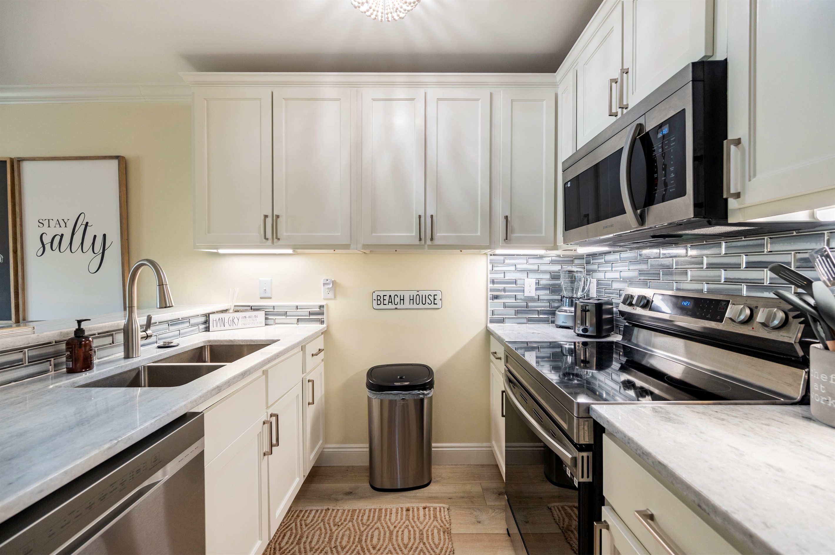 Bright coastal kitchen with modern touches, stainless steel, and beachy vibes.