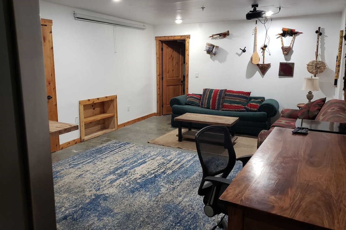 Projector movie space, Rosewood desk. Instrument collection. 