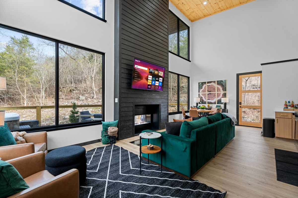 Relax in the bright and airy space living space, featuring plush seating and stunning nature views!