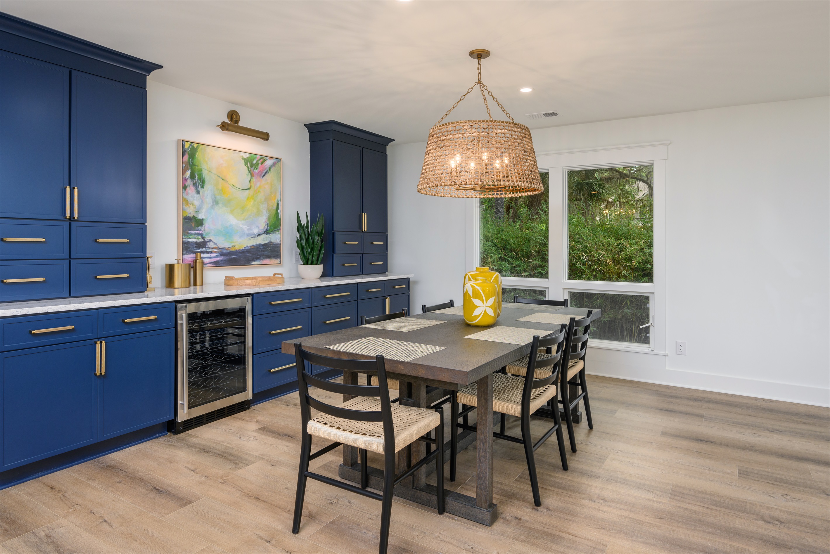 Dining area includes a wine fridge and seating for 6 at the dining room table