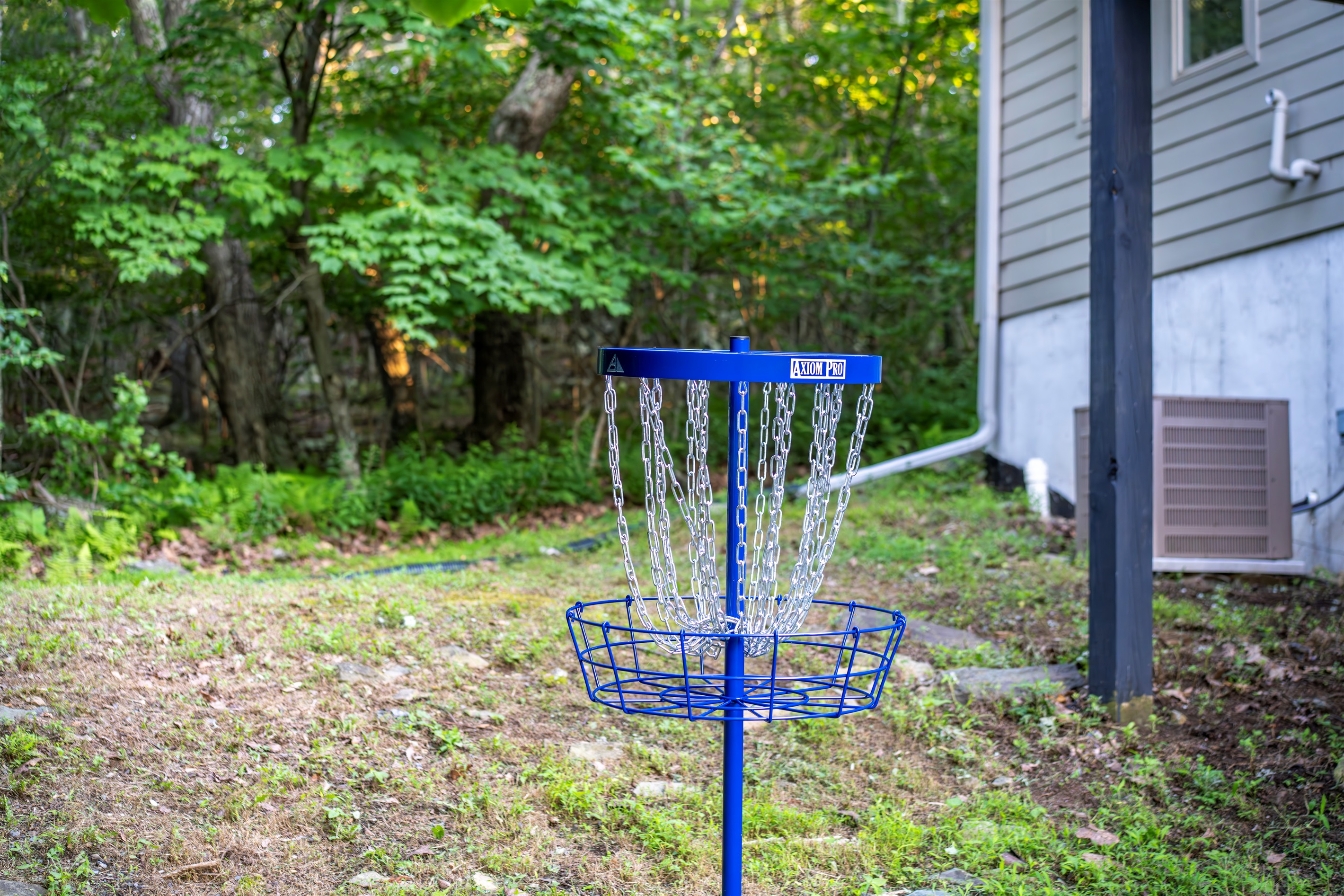 Toss a few rounds on your private disc golf basket, tucked beside the house in the wooded yard—easy fun between adventures or while dinner’s on the grill