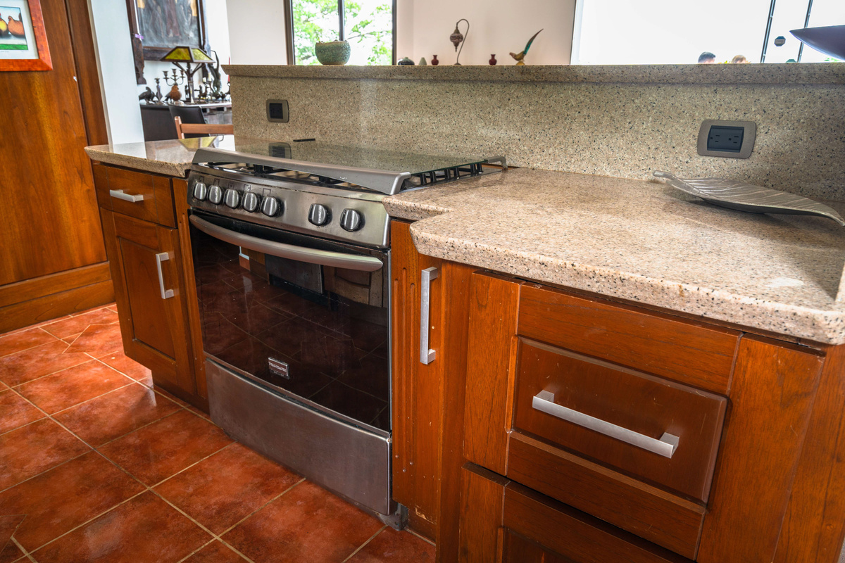  Chef's kitchen with premium stainless appliances and stone countertops