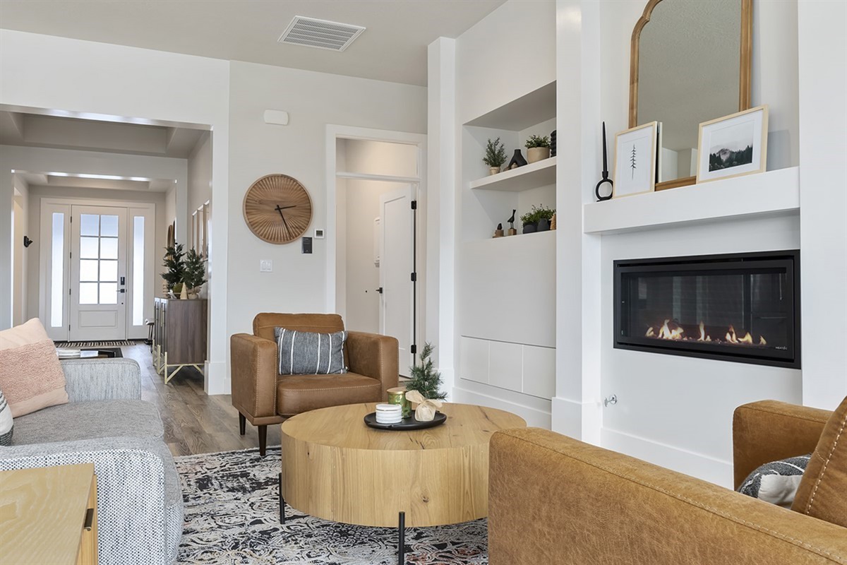 A welcoming living area with a sleek fireplace and thoughtful design throughout.
