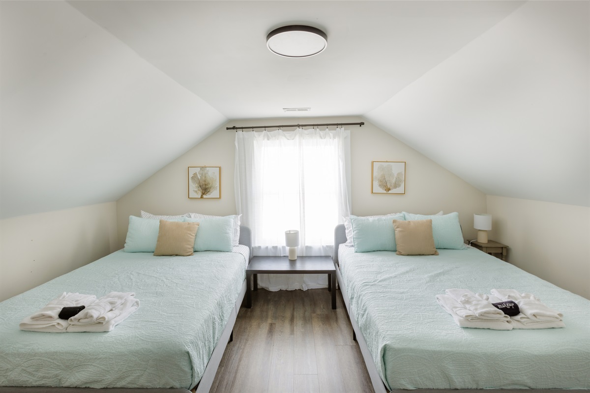 2 Queen Bedroom with clothing storage, bedside lights.