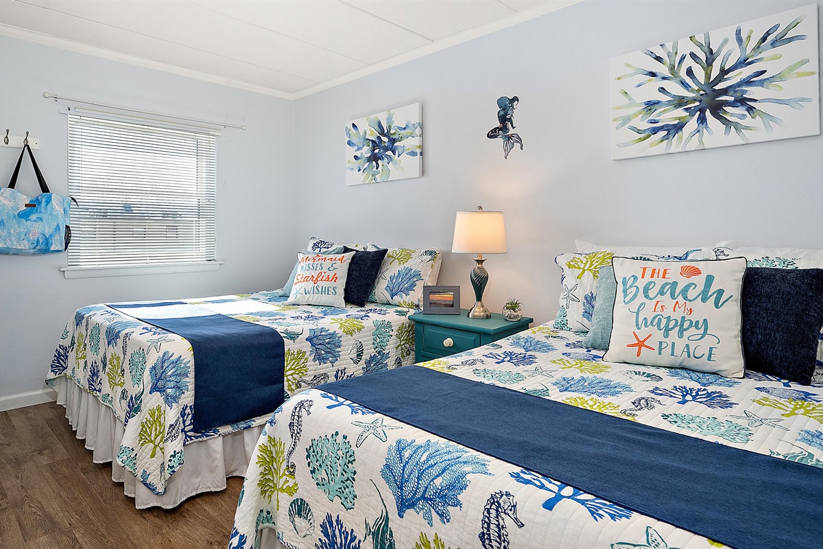 Spacious guest bedroom is equipped with 2 double beds .