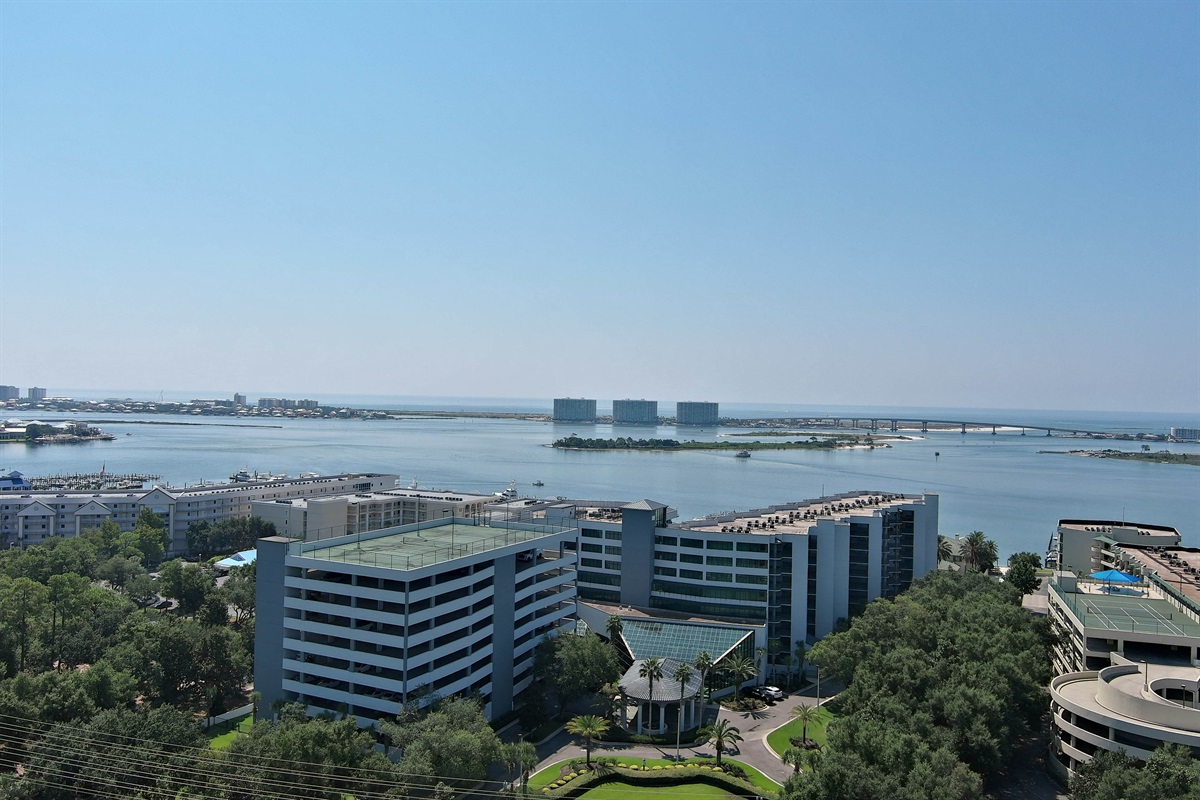 Wake up to breathtaking, panoramic views of the bay. This high-rise perspective offers a stunning glimpse of the water, the marina, and the surrounding coastal landscape.