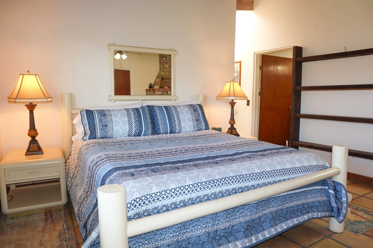 Circa Del Mar - Master Bedroom with King bed, en-suite bathroom, and fireplace.