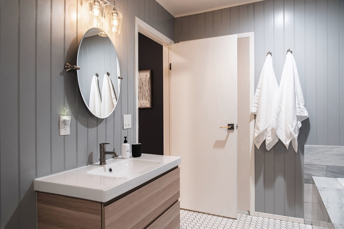 Clean, modern bathroom vanity with stylish finishes and plenty of natural light—simple, fresh, and functional.
