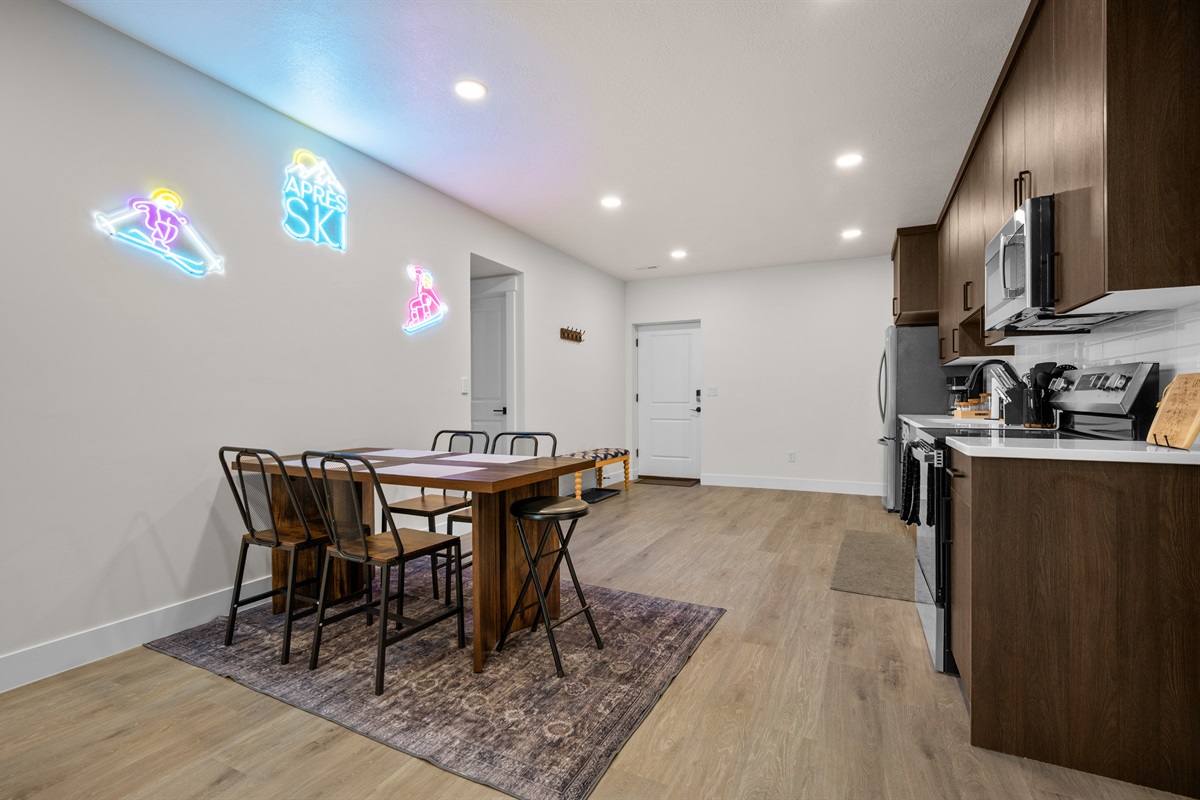 Bright lower-level dining and kitchenette area with fun après-ski lighting.