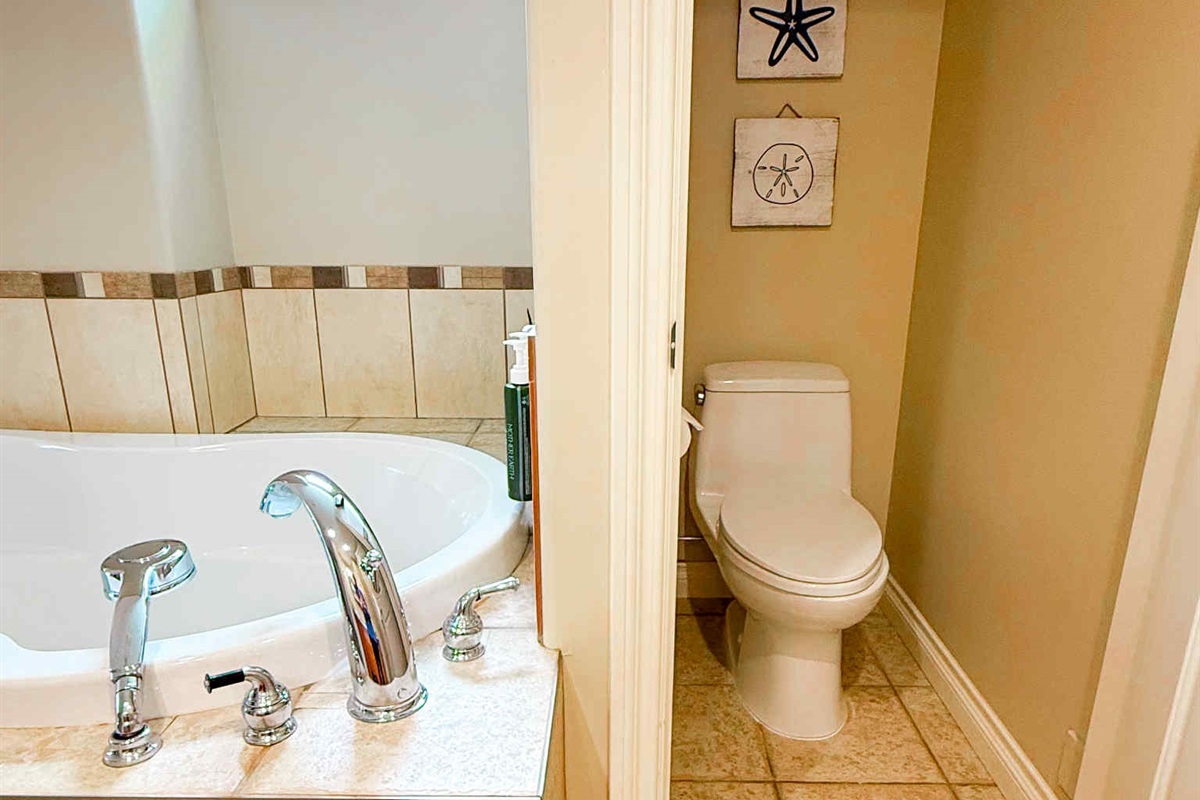 Unit A Soaker tub and private toilet in Primary bedroom.