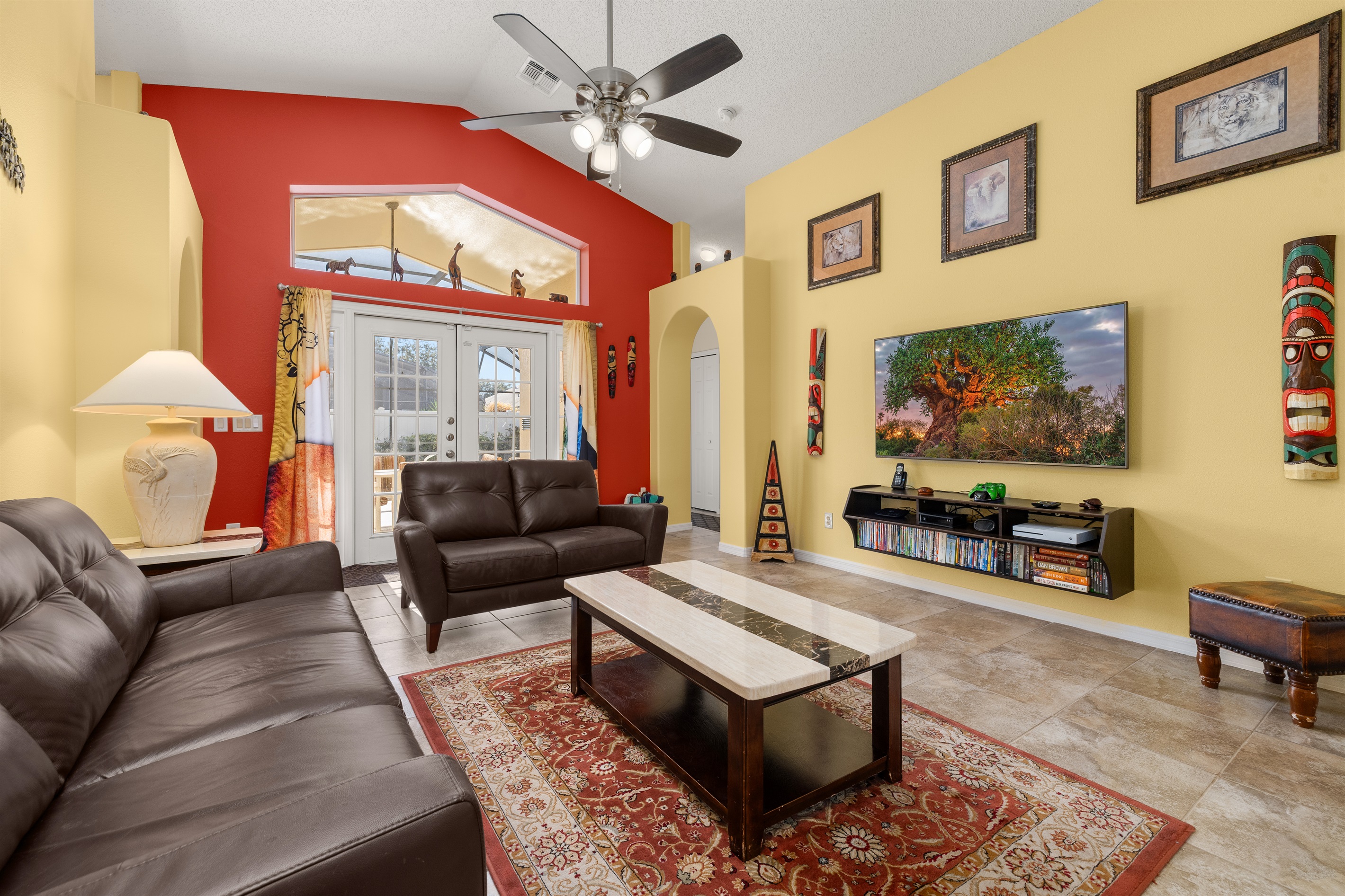 The beautiful great room is colorful, bright and open with a 65 inch TV!