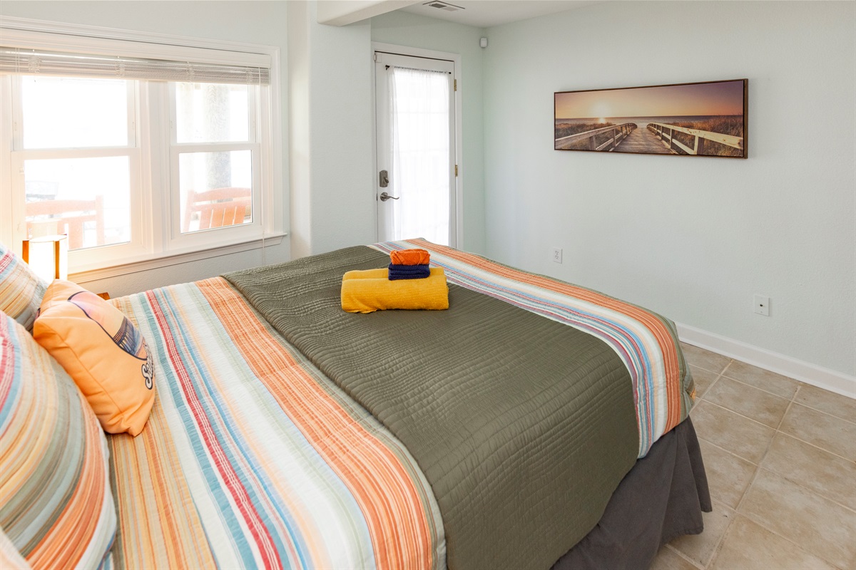 This ground floor Queen bedroom has its own door out to the pool area & hot tub