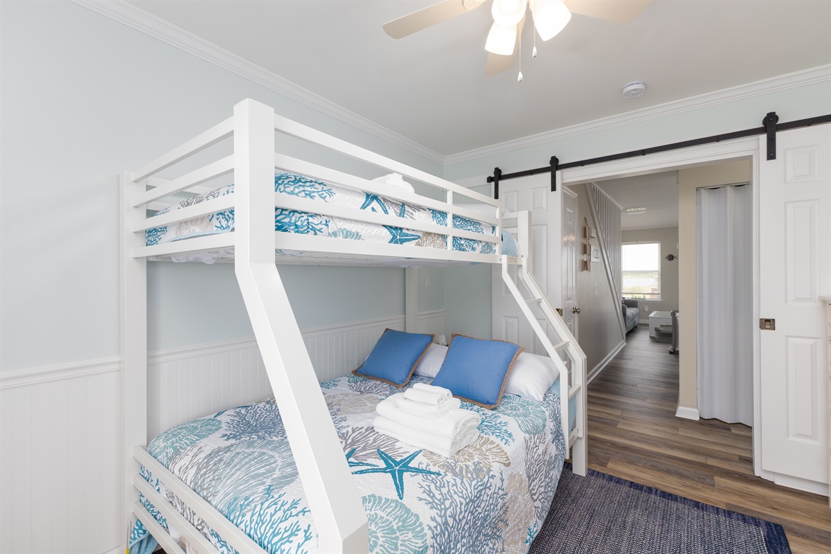 Queen-size bed under Twin bunk, ideal for accommodating multiple guests
