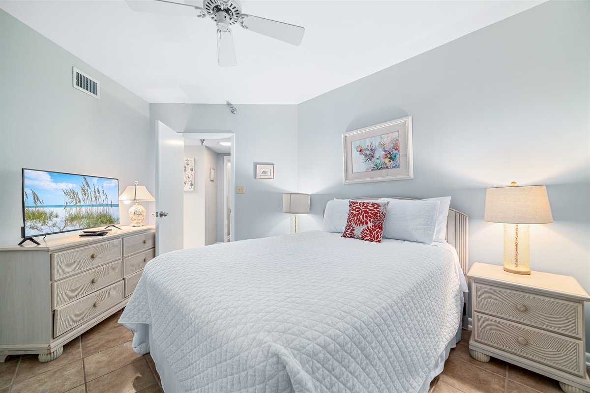 A welcoming and stylish guest bedroom with queen-sized bed designed for restful nights. The comfortable bedding and thoughtful decor create a serene retreat.
