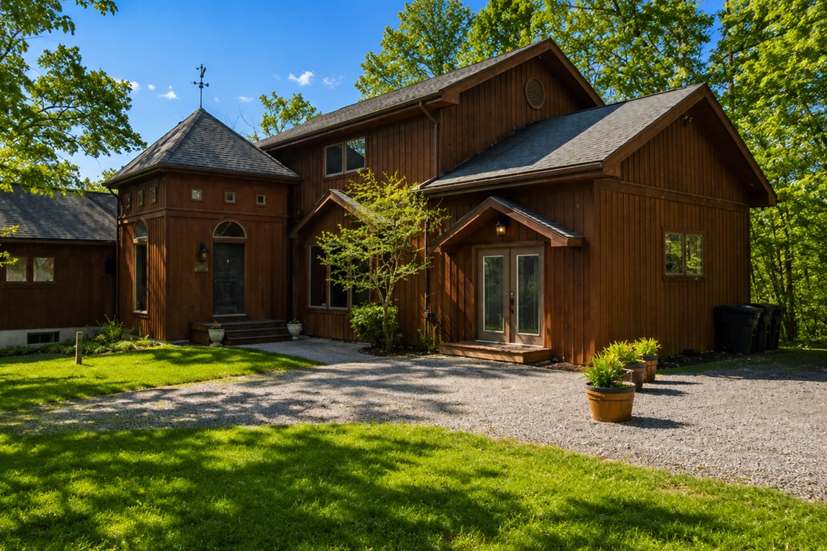 Escape to this charming lakeside retreat on Seneca Lake, featuring a rustic wooden entryway that promises a serene getaway amidst lush surroundings. Perfect for relaxation and local exploration. 