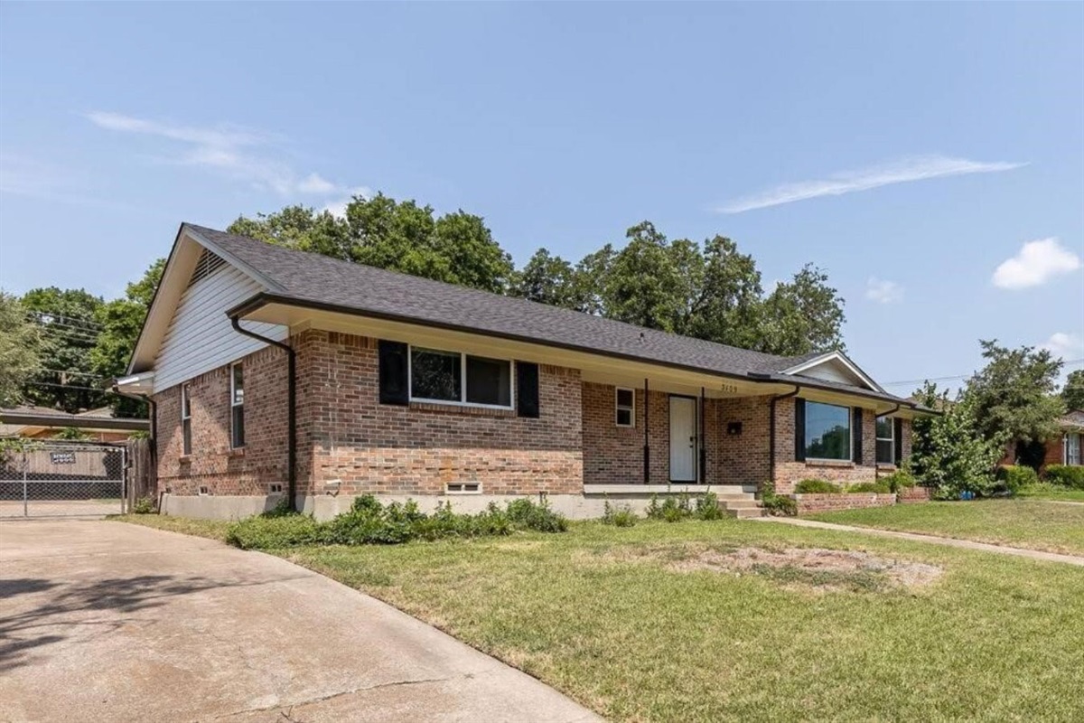 Side view of home, parking available in the drive way and up to for spots behind the home or additional space on the street