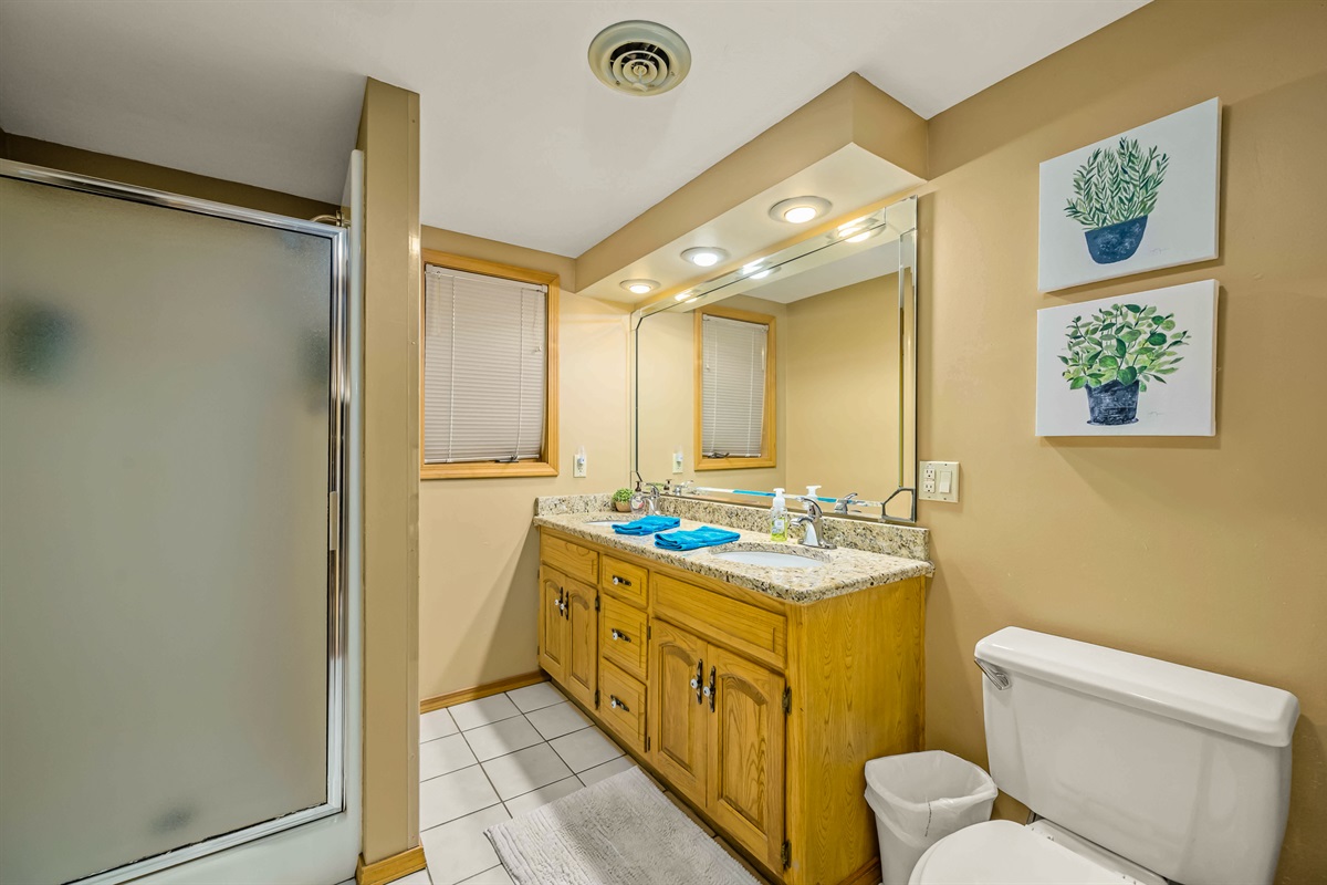 Bathroom for two of the lower king bedrooms and game/living area.