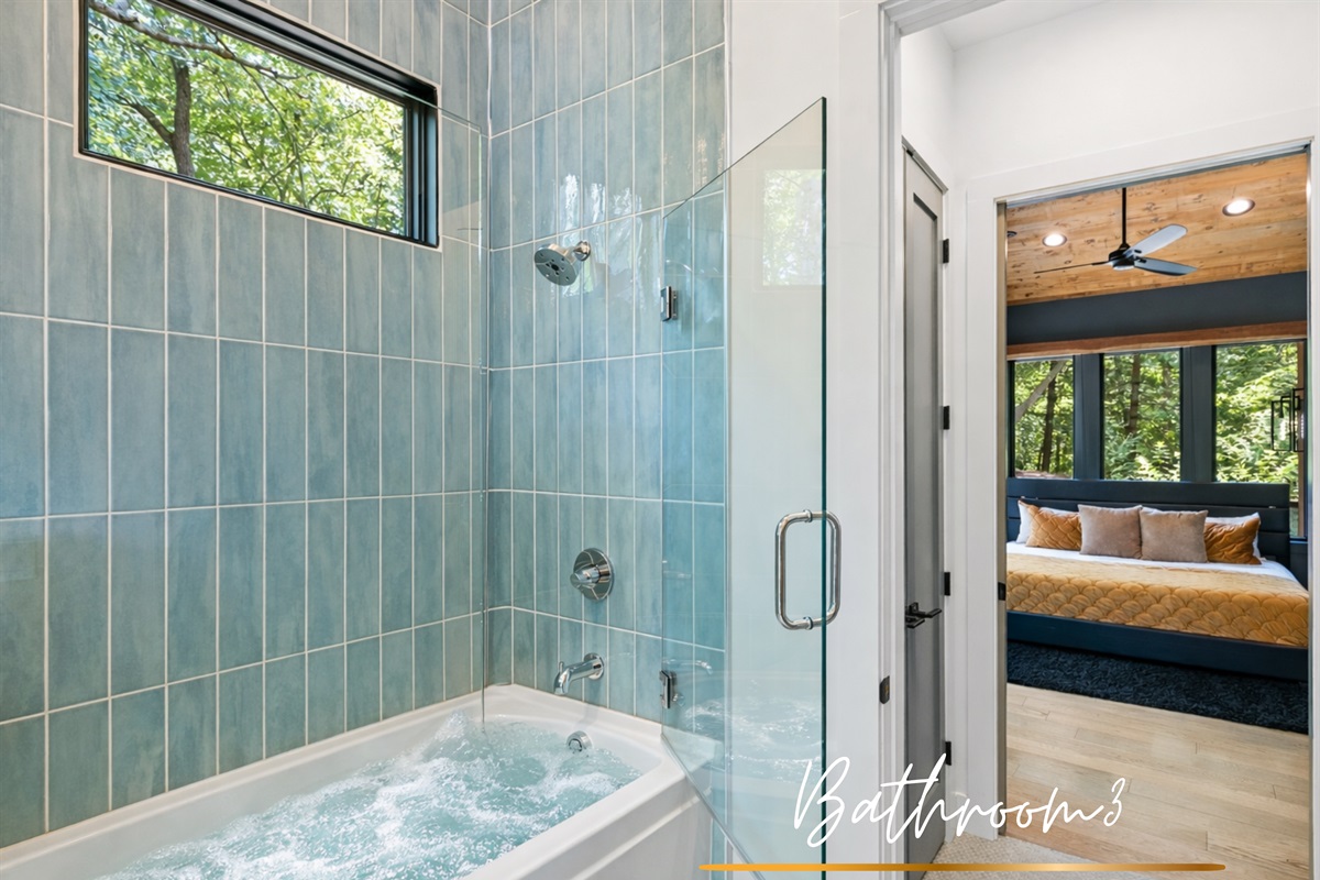 A bright and stylish bathroom with a combination tub and shower, offering both comfort and convenience.