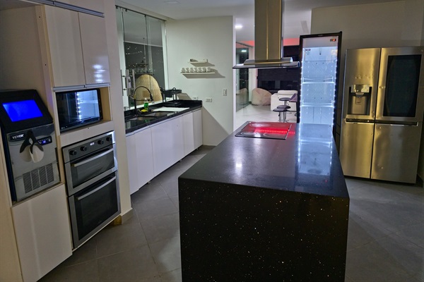 Full kitchen with ICE MAKER, 2 refrigerators, microwave, oven, and around 30 plates/bowls