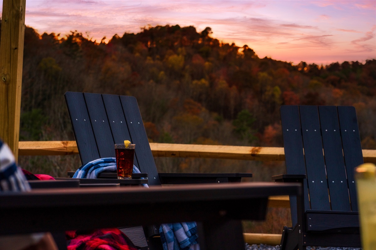 Fire Pit in backyard with picnic tables & views