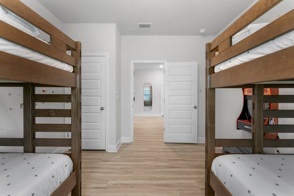 Perfect for kids or teens—sleep and play with bunk beds and arcade entertainment.