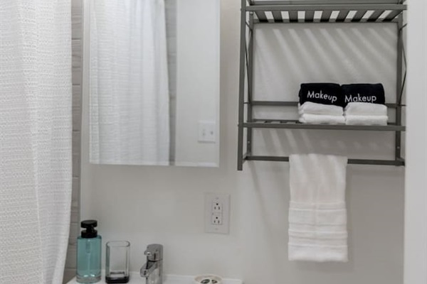 Modern full bathroom with sleek fixtures and plenty of space for a refreshing and relaxing experience.
