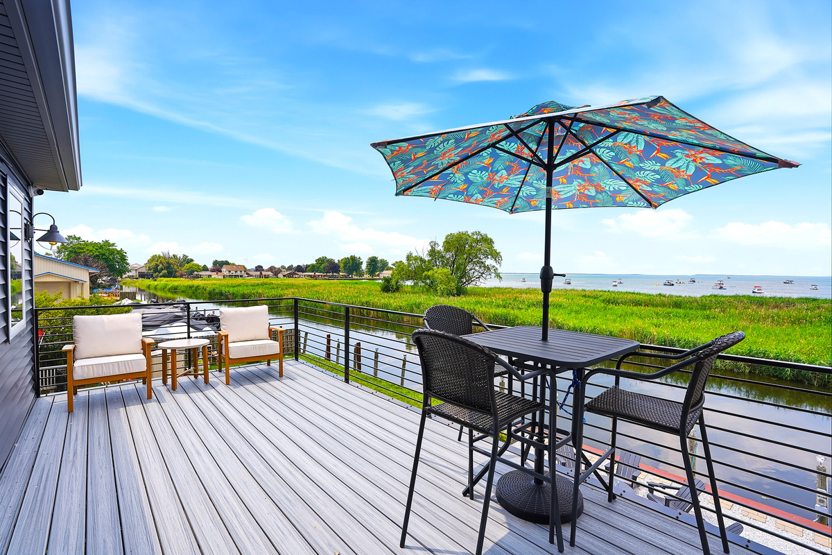 Your private balcony overlooks the peaceful canal while offering views toward Lake St. Clair's popular sandy swimming area, creating the perfect place to unwind any time of day.