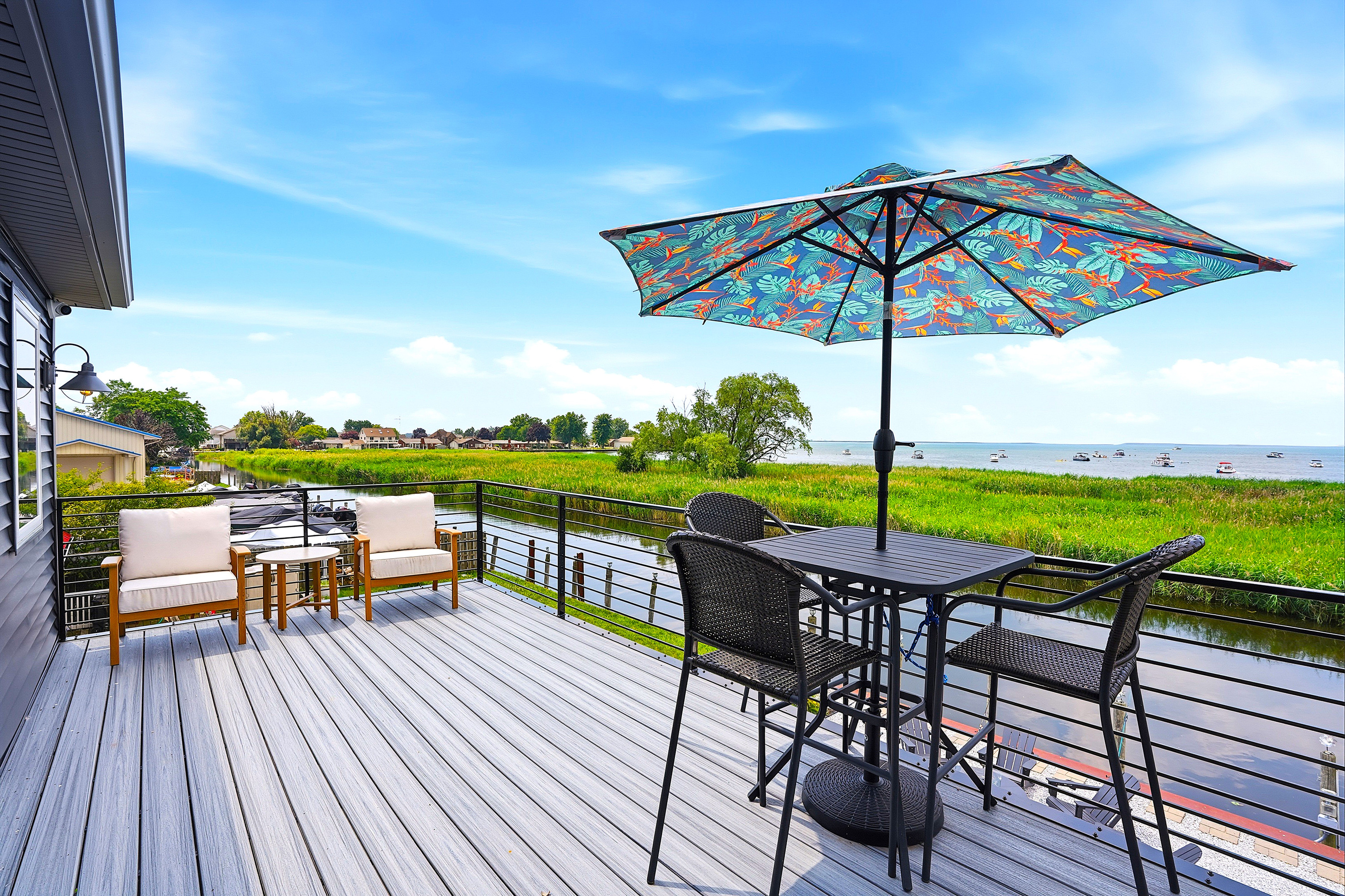 Your private balcony overlooks the peaceful canal while offering views toward Lake St. Clair's popular sandy swimming area, creating the perfect place to unwind any time of day.