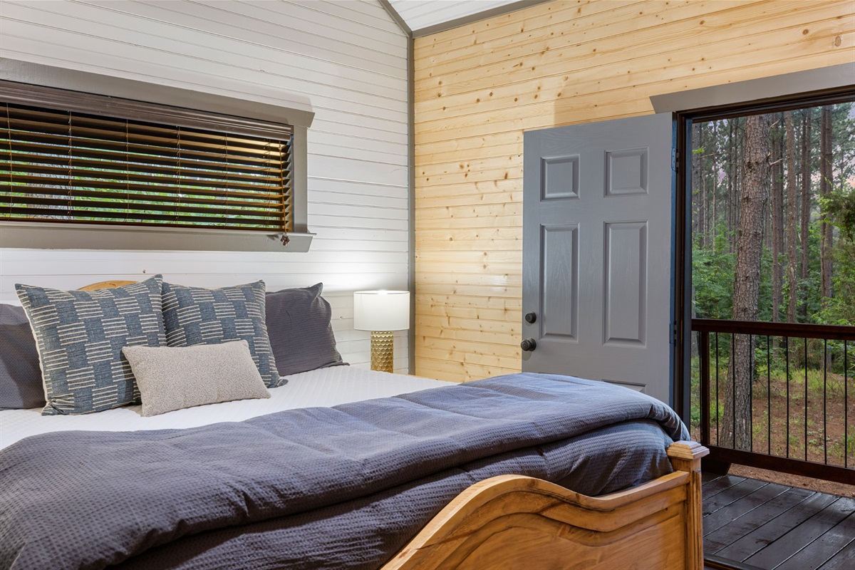 The Great Smoky Mountain king suite. Gives a camp-like feel with high ceilings, natural light. Private balcony for sunrise and stargazing.