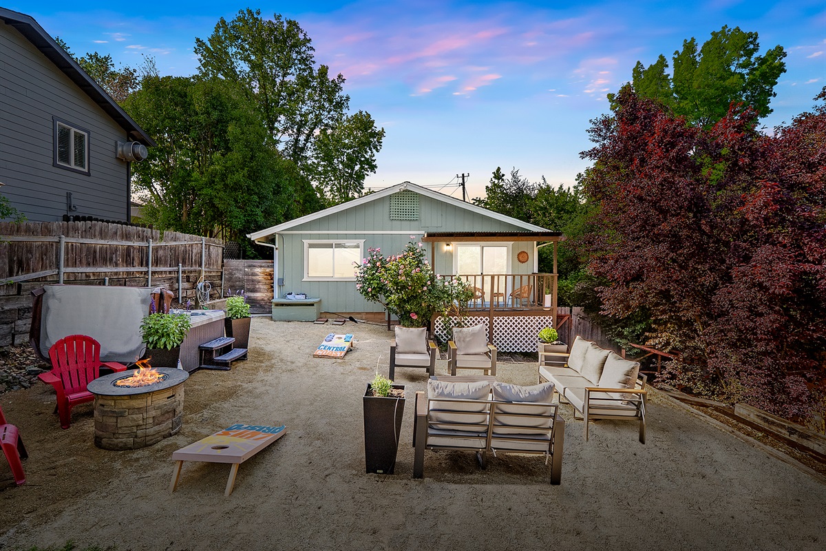 Experience the ultimate backyard escape with cozy seating and evening fun.