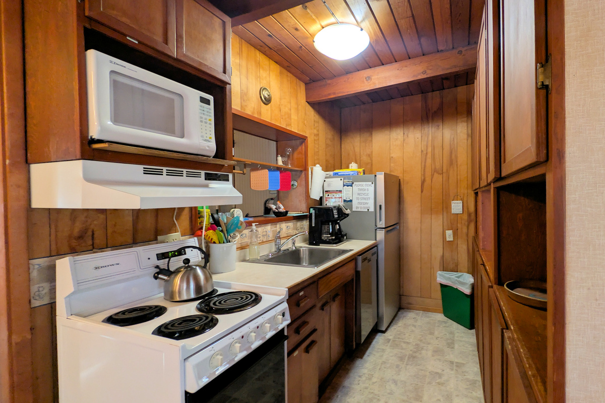 kitchen has apartment size dishwasher & refrigerator